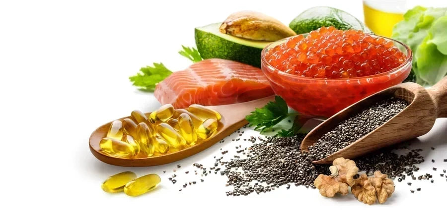 Fish oil caplets next to a salmon filet and various health foods.