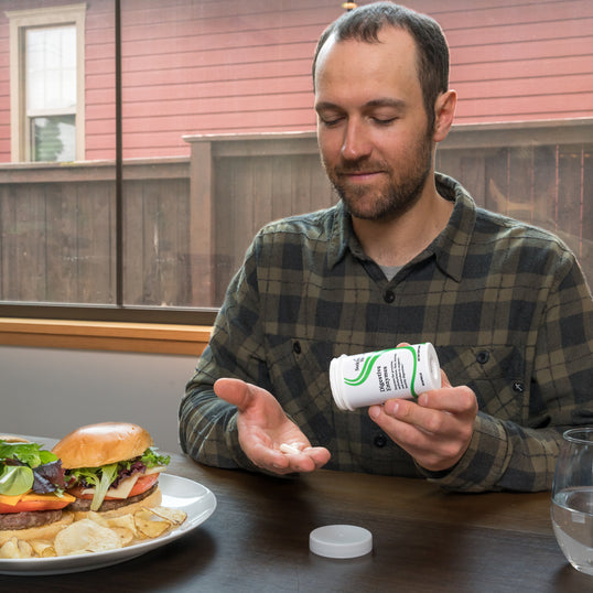 A man holding Digestive Enzymes