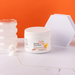Container of 'Optimal Electrolyte' on a marble surface with an orange background | Peach / 1 Pack, Peach / 3 Pack, Peach / 6 Pack