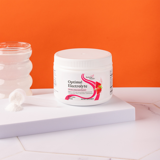 Container of 'Optimal Electrolyte' on a white surface with an orange  background