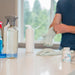 Image of man putting on cleaning gloves 
