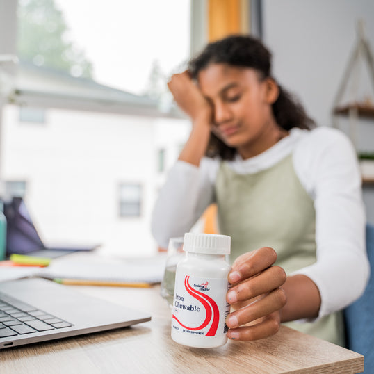 Image of woman tired at desk