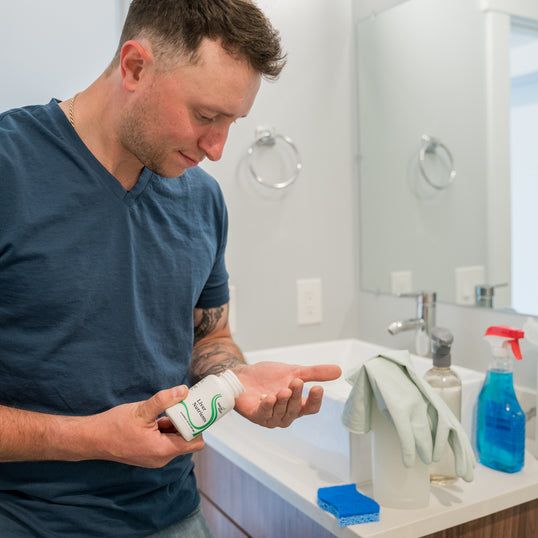 Image of man pouring product into hand