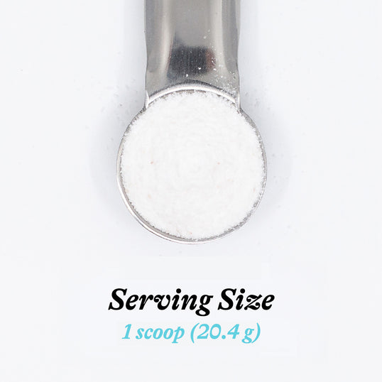 Metallic scoop with a small amount of powder on a white background, displaying 'Serving Size 1 scoop (20.4 g)'.