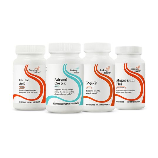 Four supplement bottles from Seeking Health on a white background