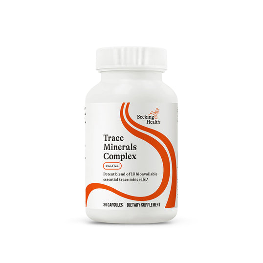 Supplement bottle labeled 'Trace Minerals Complex' by Seeking Health on a white background